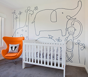 Modern jungle animals safari gender neutral baby nursery room theme decor in grey white and orange