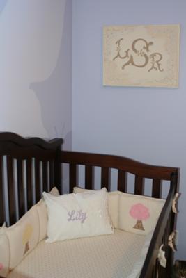 The monogram painting with Lily's Initials and her baby bedding
