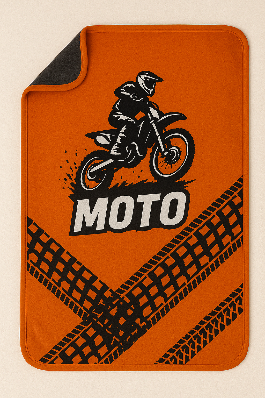Motocross baby blanket with dirt bike graphics in orange and black