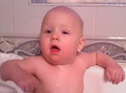 My baby boy, Bentley LOVES his bath but gets very irritated by disposable diapers!