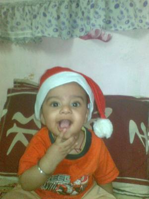 MY SMILING BABY BOY in  his SANTA CLAUS HAT!