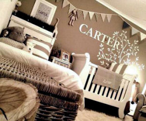 Nature forest theme baby nursery for a boy decorated in earth tones and antique white