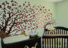 pale green nursery wall with red tree mural forest theme