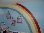 Rainbow painting in a Noah s Ark baby nursery for twins