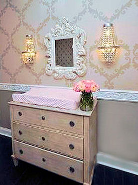 Vintage painted baby dresser with crystal pulls in a baby girl nursery room