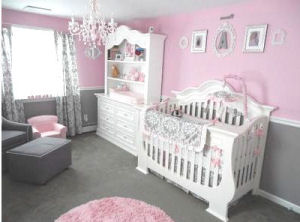 White nursery chair rail wainscoting in a pink and grey baby girl princess nursery