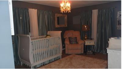 A beautiful baby boy nursery room decorated in a vintage cars theme and sea green and white color scheme