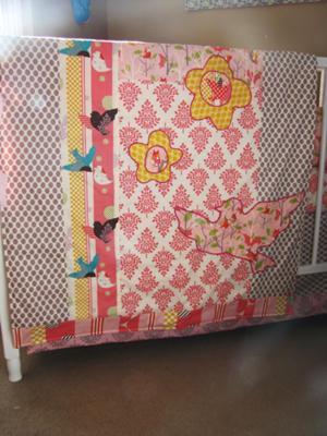 Baby crib quilt made using fabric from the 