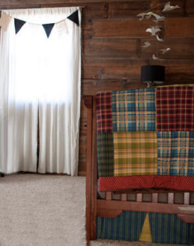 Rustic patchwork baby quilt for a baby boy nursery made using a combination of plaid and striped fabrics