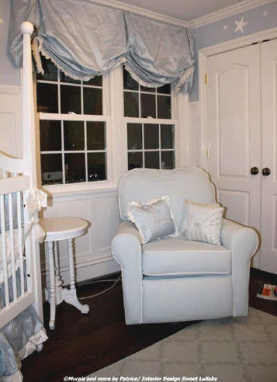 Baby blue and white reading area in a boy nursery