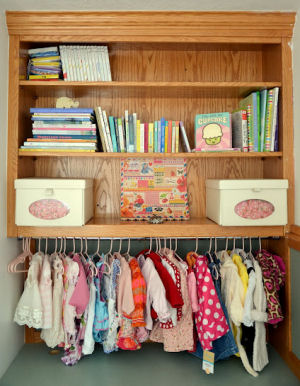 Peach and white homemade storage boxes for baby girl's nursery closet