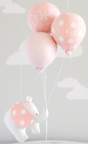 Homemade pink and white polka dot elephant hot air balloon baby crib mobile.
