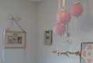 feminine pastel pink pale light green baby girl nursery paint wall color paper lanterns decorations mobile