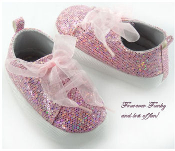 Baby shoes covered in pink sequins for baby girls