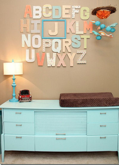 Wooden alphabet wall letters and framed baby initial in a boy nursery
