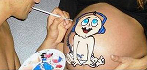 Pregnancy belly painting of a baby listening to music with headphones