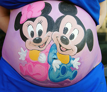 Fun Mickey and Minnie Mouse Disney cartoon character pregnancy belly painting idea for twins baby boy and girl