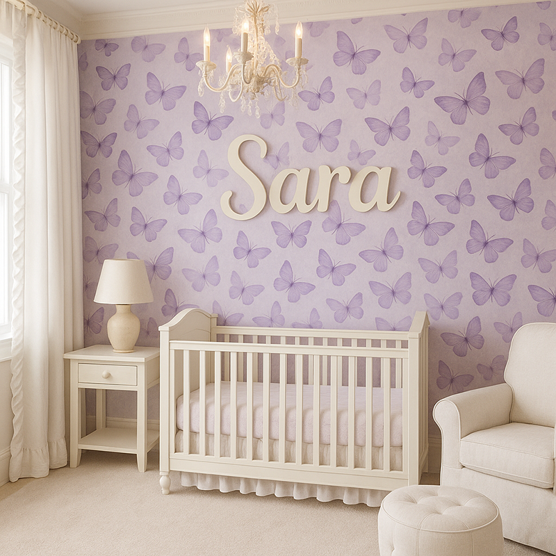 Elegant purple butterfly themed nursery with white ruffled curtains, chandelier, gold name sign reading Sara, and soft lavender butterfly wallpaper
