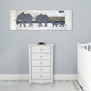 Reclaimed wood art for a baby elephant nursery theme.