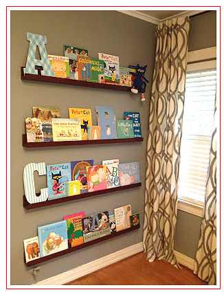 Floating shelves filled with books decorate the walls in a modern nursery