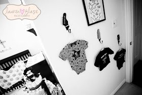 Rock star baby onesies used as nursery room wall decorations