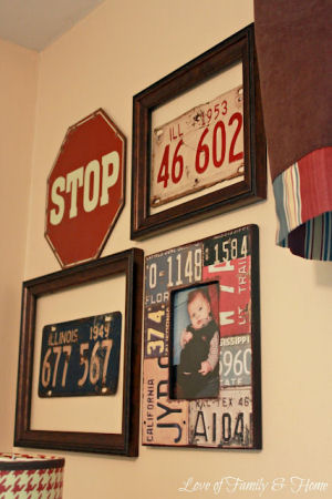Baby boy gallery nursery wall display including including framed vintage car tags and street signs