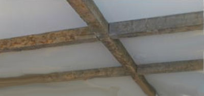 Exposed log beams ceiling decor in a rustic baby nursery room