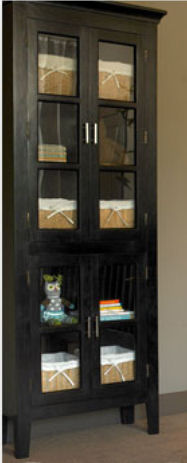 Rustic antique walnut glass front cabinet holding organizer baskets can be used as baby nursery storage