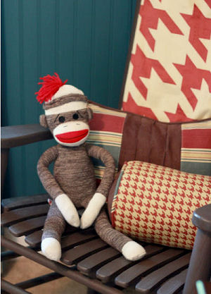 Bright brick red gray and ivory white sock monkey baby nursery crib bedding set for a boy or girl room decor