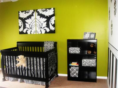 Elegant nursery decorated in black and white damask with green accents for a baby girl