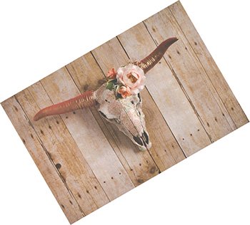 Cow skull wall decor with floral arrangement made of silk flowers