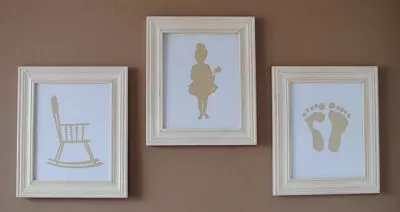Create personalized nursery wall decor using your own Silhouette SD!<br><BR>This mom chose to frame a rocking chair, a fairytale ballerina and her baby's footprints in pink.  <BR><BR>The artwork looks amazing on the brown paint color of the nursery wall. 