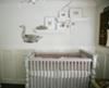 A baby nursery decorated with vintage finds, antique features and a unique homemade mangle cloth and lace crib bedding set.