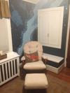 A cozy corner in the nursery where mom and dad can enjoy their little one