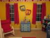 The topsy turvy wall plates decorate the wall between the red curtain panels in our baby boy's Dr Seuss theme nursery. 