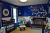 A navy blue owl nursery theme for a baby boy.