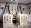 Elegant twin boys nursery decorated in blue and brown