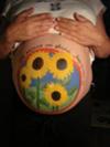 More pregnant belly pictures in our countdown - Sunflower tummy painting 