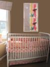 Our baby girl's colorful custom nursery was designed with bedding and nursery decor from the 