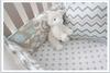 Beautiful taupe and baby blue nursery bedding set in chevron stripes polka dots and modern floral pattern fabrics.