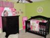 Lime green, hot pink and white baby girl nursery theme.  The pink and green nursery is decorated with frogs, butterflies and flowers accented with striped fabrics and a personalized wall decal that features a monogram with our baby girl's initial, the letter 