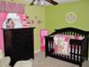 Lime green, hot pink and white baby girl nursery theme.  The pink and green nursery is decorated with frogs, butterflies and flowers accented with striped fabrics and a personalized wall decal that features a monogram with our baby girl's initial, the letter 
