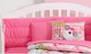 Fun bright pink monkey baby crib bedding and decorations for a girl nursery room.