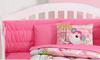 Fun bright pink monkey baby crib bedding and decorations for a girl nursery room.