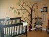 Our hand-painted tree wall mural with monkeys swinging through the branches surrounded by fluttering butterflies.   