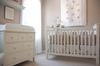 Our baby girl's white heirloom nursery decor includes a Pottery Barn Kids Kendall crib and dresser with clean lines. 