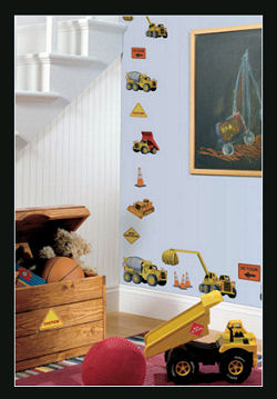 Dump trucks, cement mixers and colorful dirt diggers are so cute on a baby boy's nursery wall.
