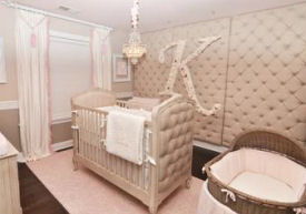 Baby girl nursery with a tufted stencil design on the walls