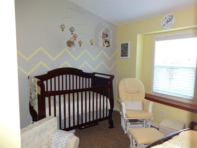 View of my baby girl's grey and yellow hot air balloon nursery theme.