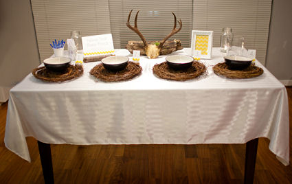Deer horns baby shower centerpiece and soup bowls on rustic chargers